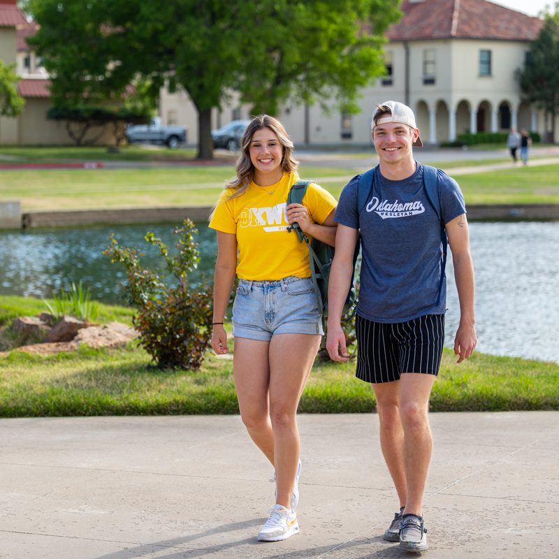 young students walking on patio