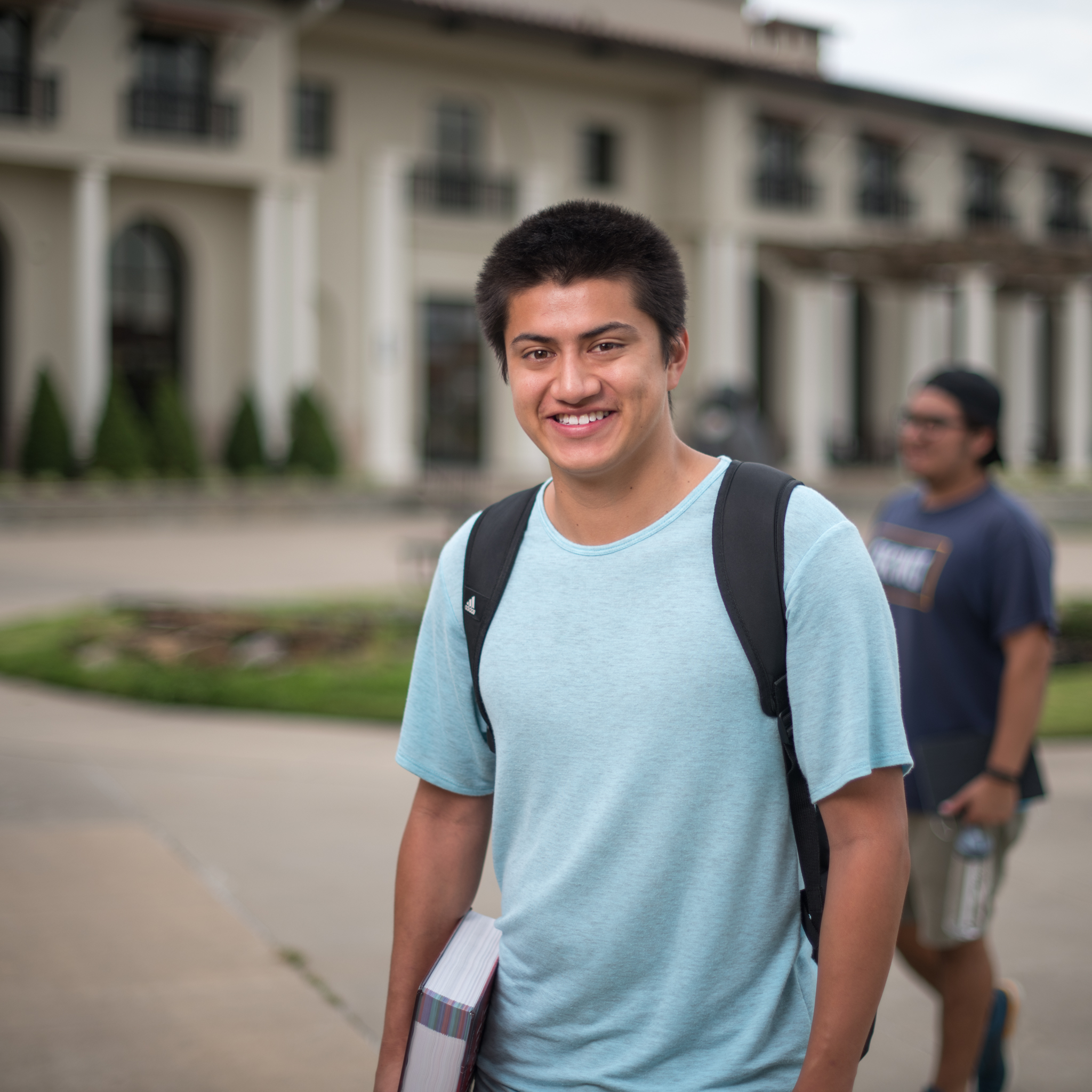 student standing on campus