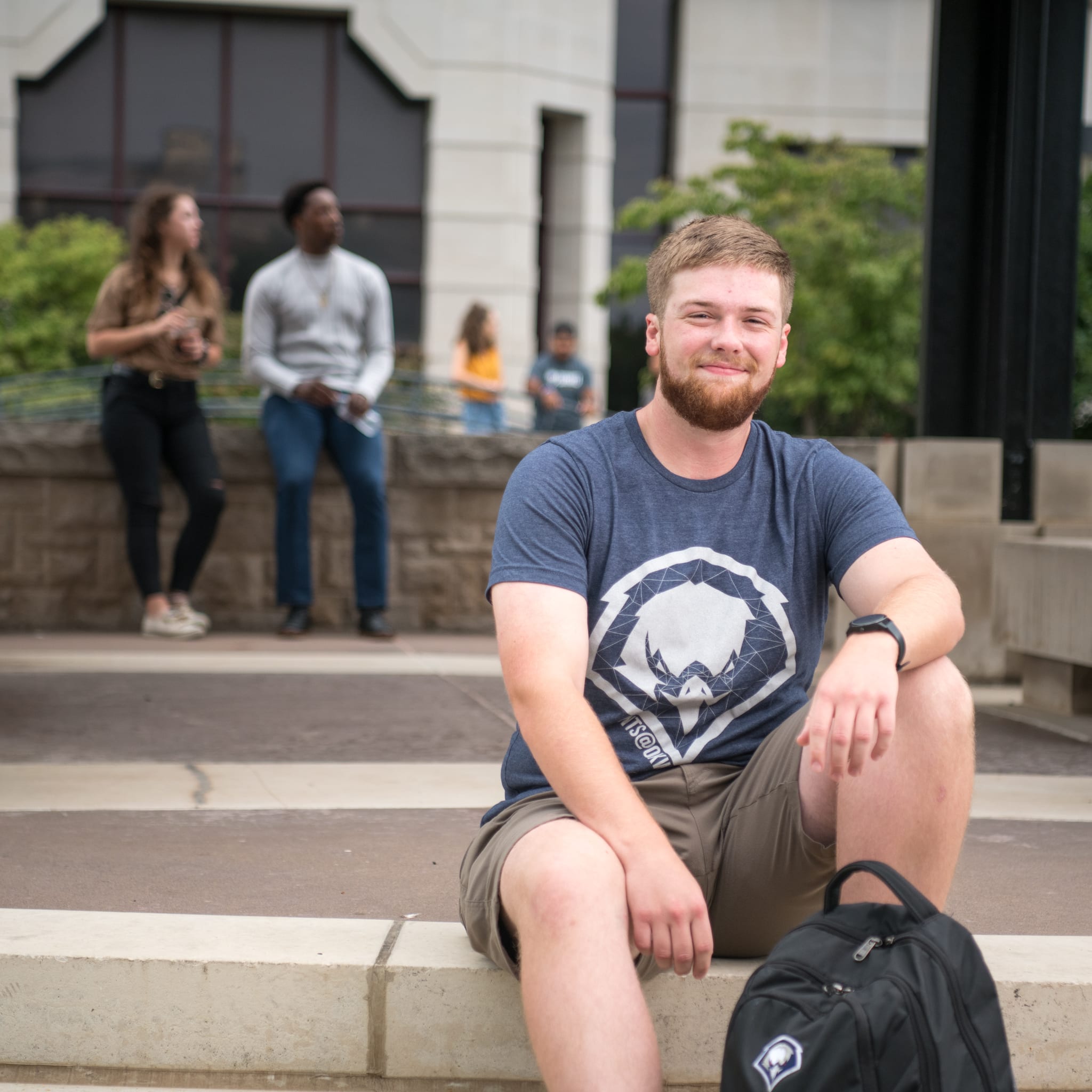 student sitting on steps