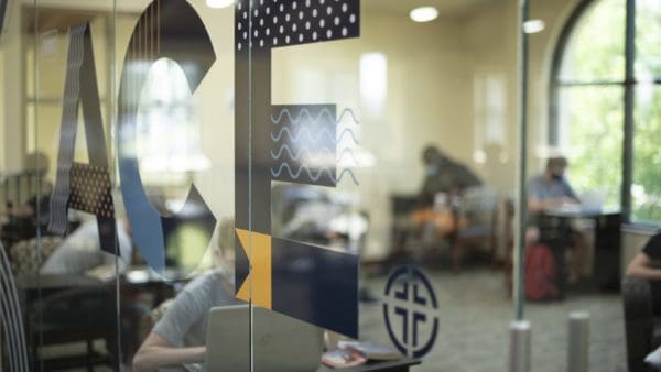 Mural on glass wall of Academic Center for Excellence