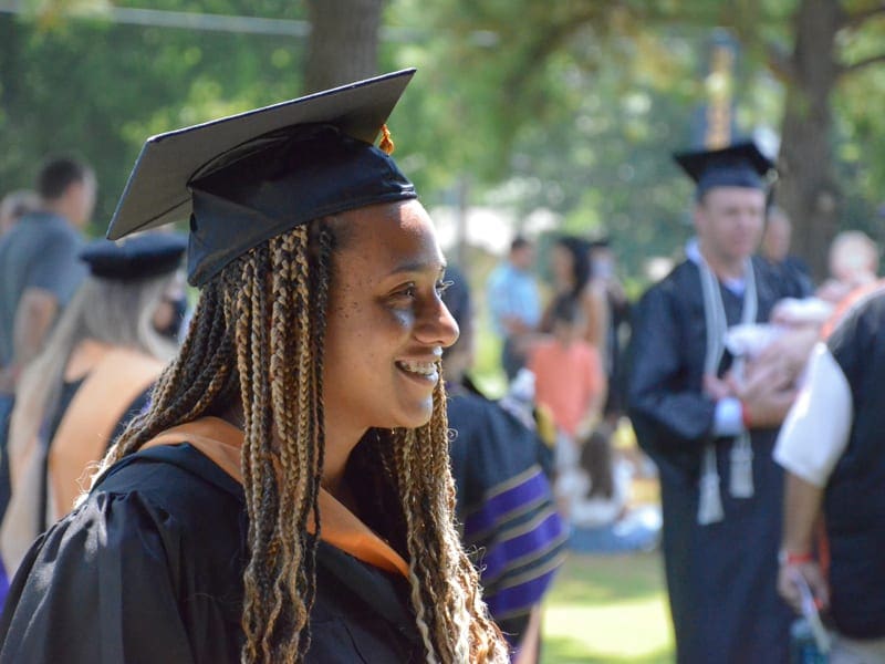 graduate-smiling-woman graduate smiling in regalia