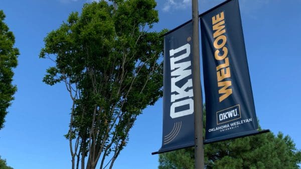 okwu welcome banner on campus