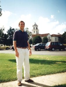 Student in front of mansion