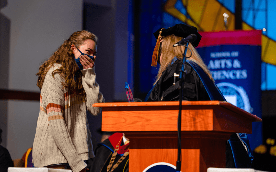 Student receiving award