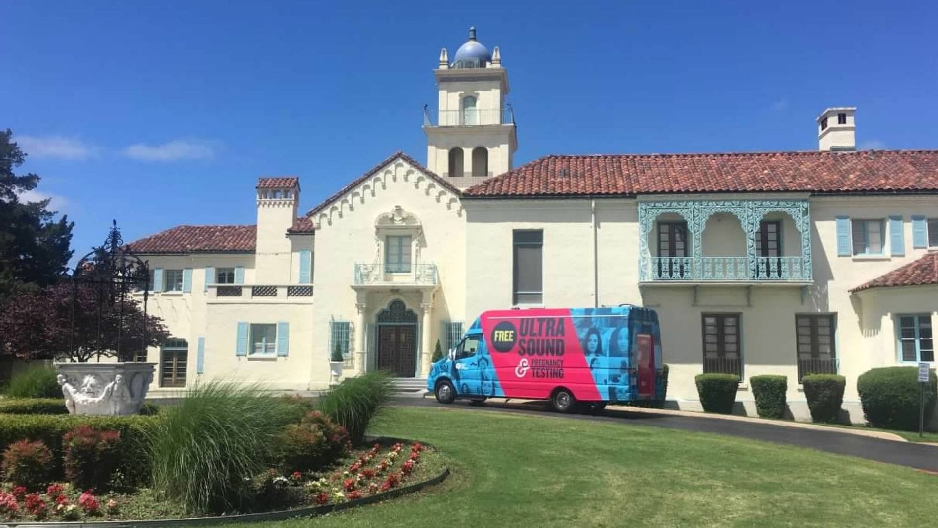 Ultrasound van in front of mansion