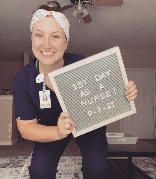 student with letterboard