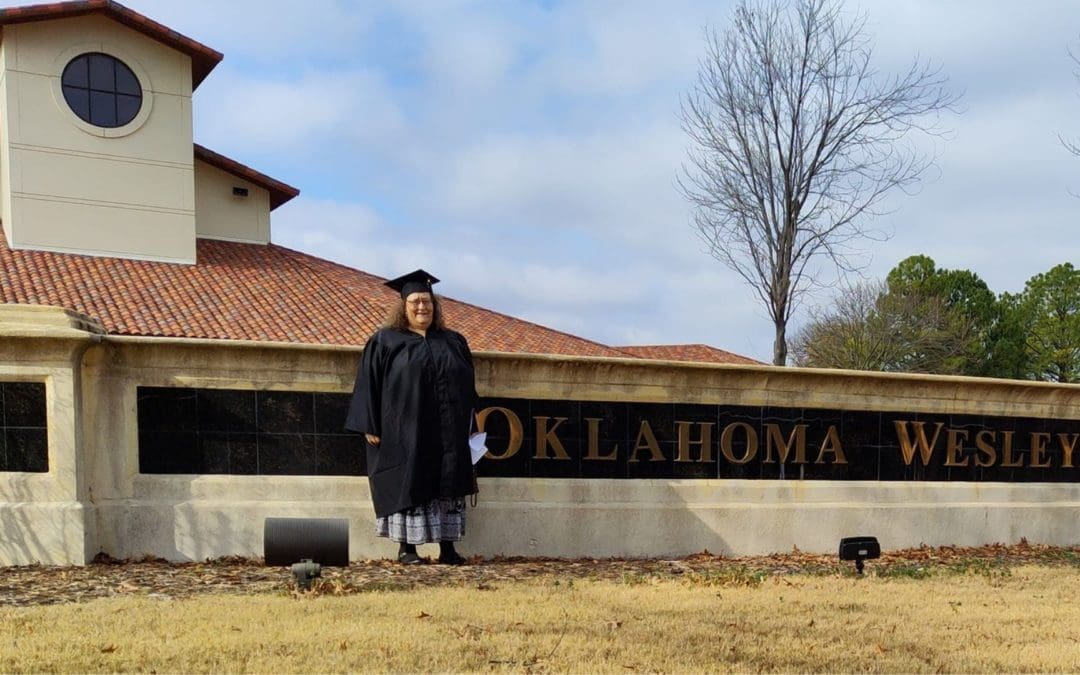 women in front of campus