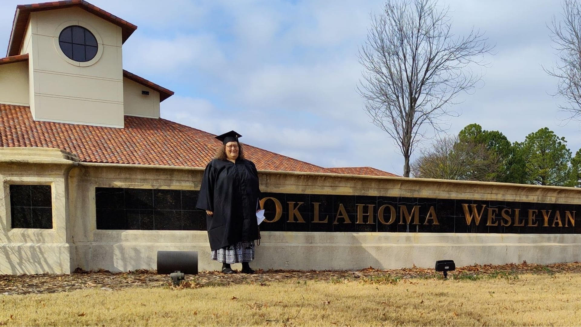 women in front of campus