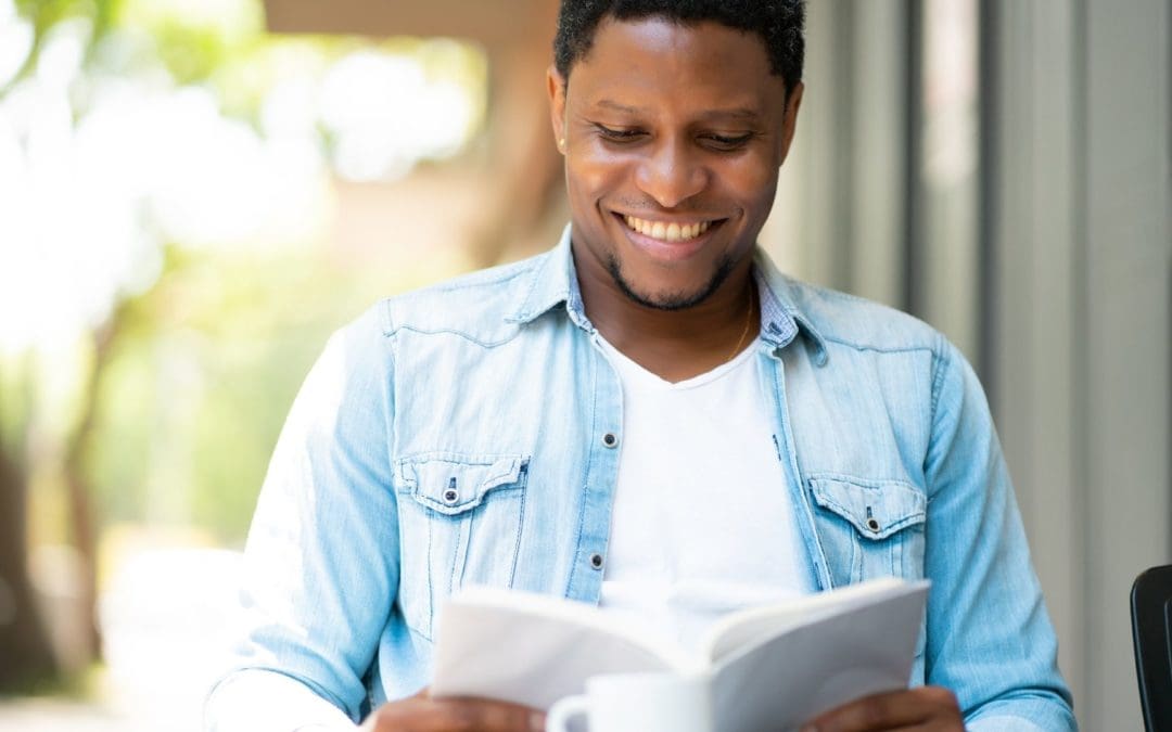 man in coffeeshop reading