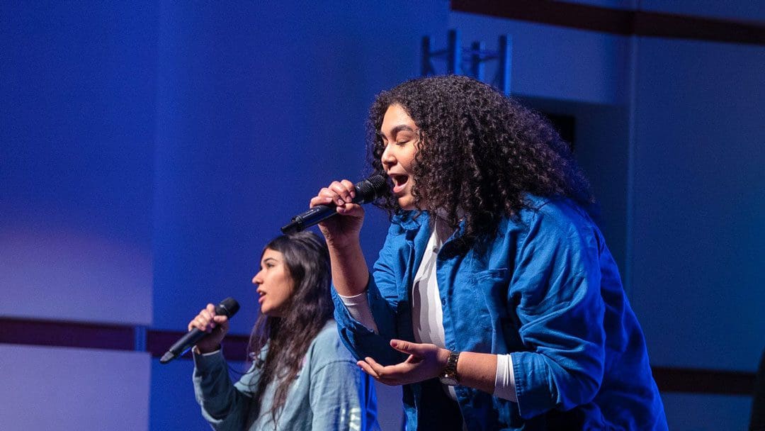 Students leading worship in chapel