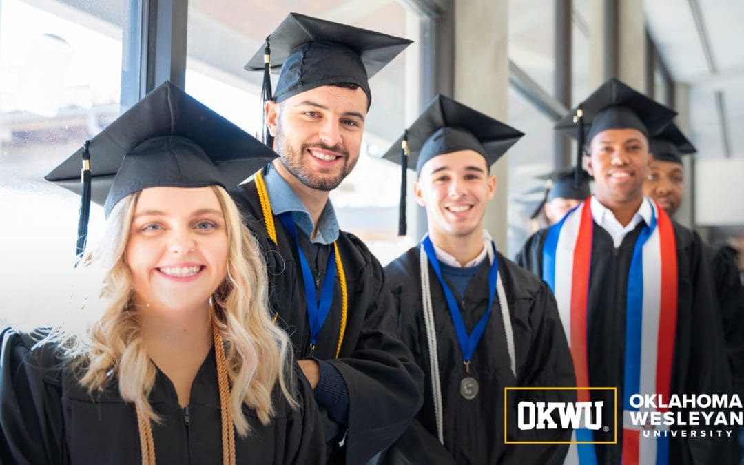 smiling group of OKWU graduates