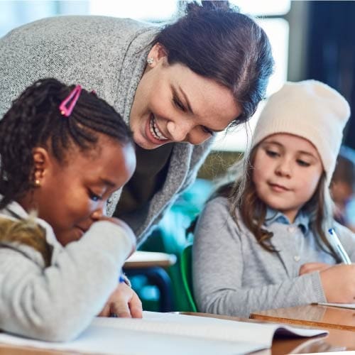 Teacher in the classroom with elementary students