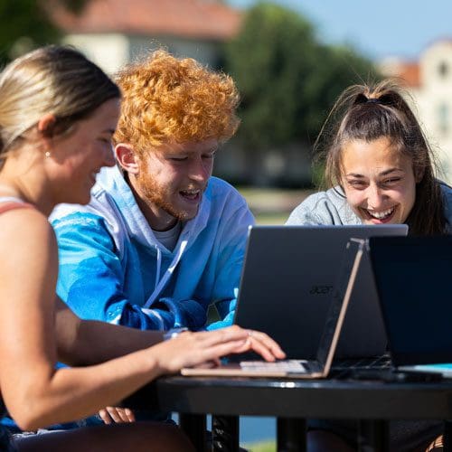 OKWU students studying outside