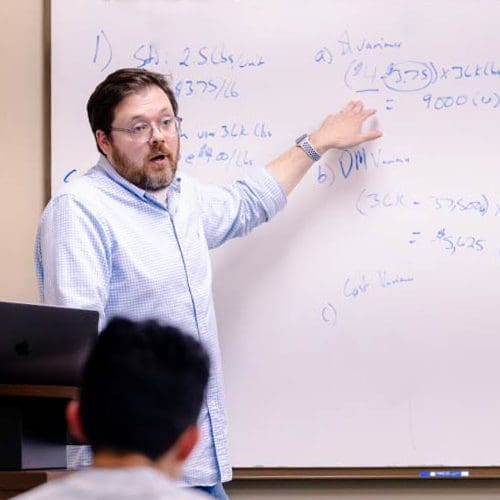 Accounting professor Jason Bussey teaching in class