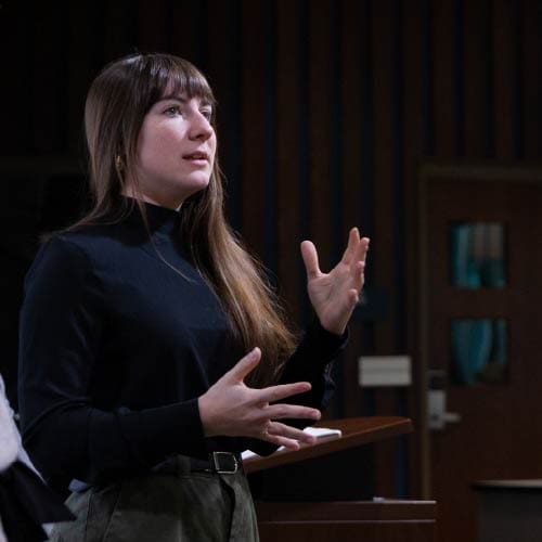 Speaker teaching in front of OKWU Business students