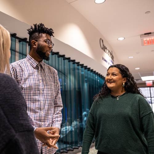 Two OKWU students chatting in the Keating Center Two OKWU students chatting in the Keating Center