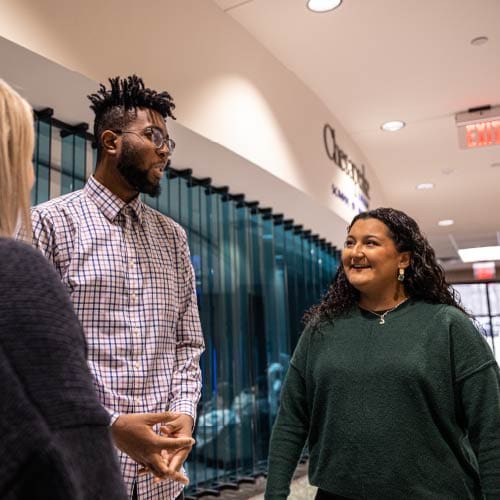 Two OKWU students chatting in the Keating Center