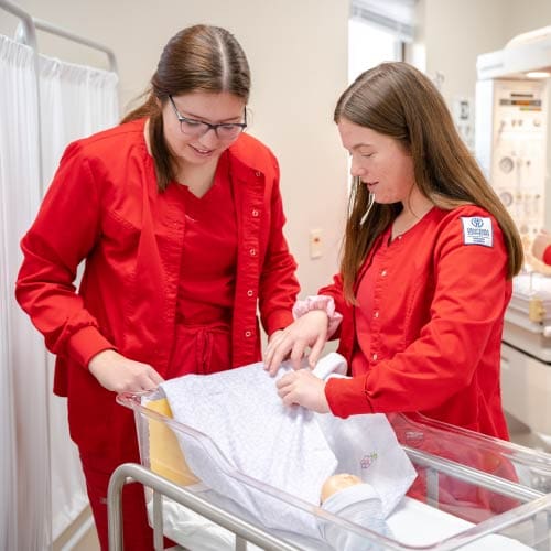 OKWU Nursing students working together during a simulation