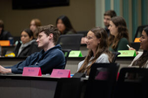 Blake Hamblin and other student's engaging with Pareto Group guest speaker during class.
