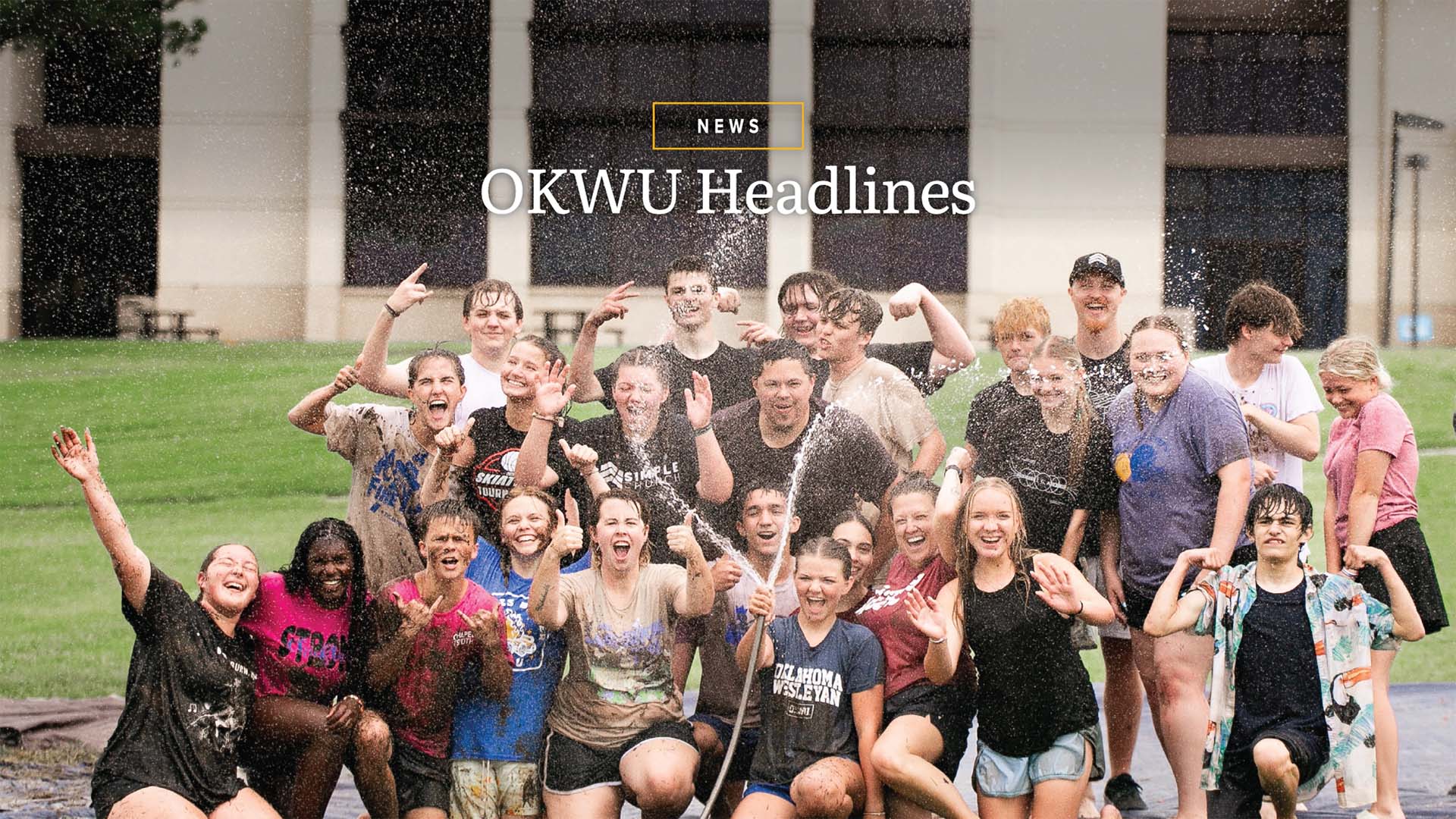 Group of OKWU students posing in a group at the slide-n-slide party